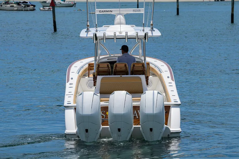 Slide: The Image of 2023 Valhalla Boatworks V-37 with triple engines cruising on calm water. - 8