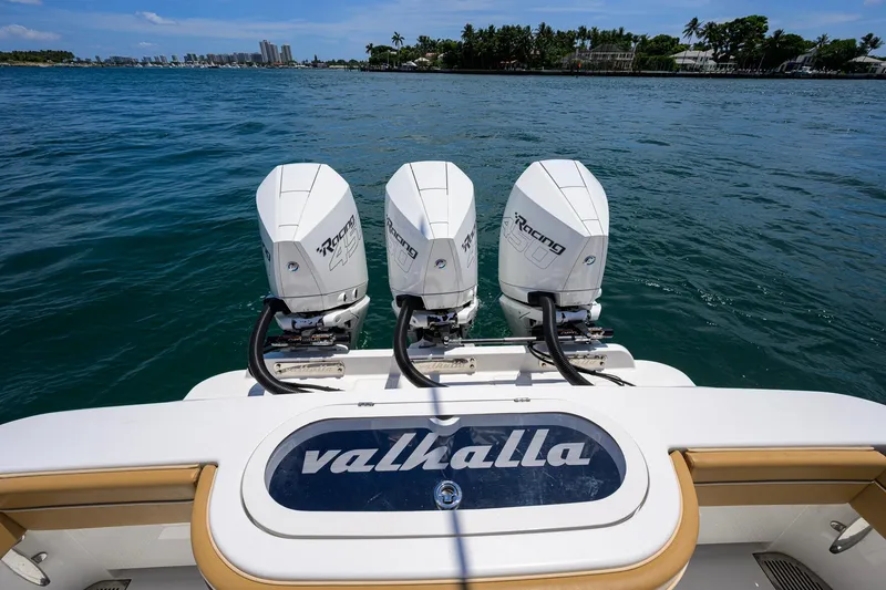 Slide: The Image of 2023 Valhalla Boatworks V-37 with triple outboard engines on open water. - 53
