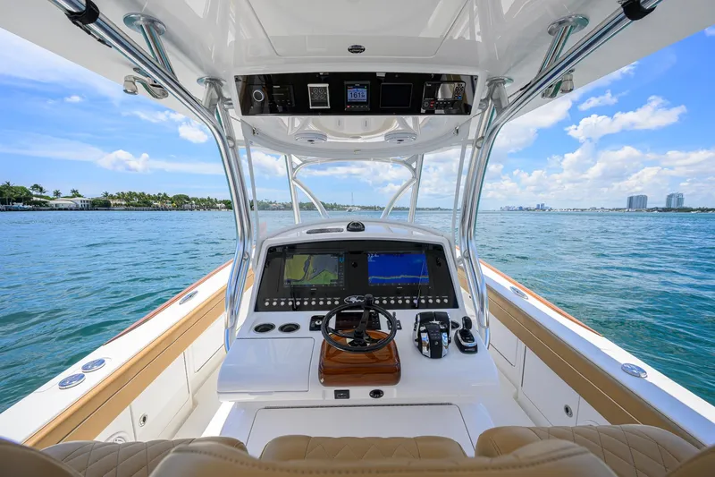 Slide: The Image of 2023 Valhalla Boatworks V-37 helm with navigation screens on open water. - 13