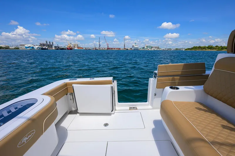 Slide: The Image of 2023 Valhalla Boatworks V-37 on water, featuring tan seating and ocean view. - 41