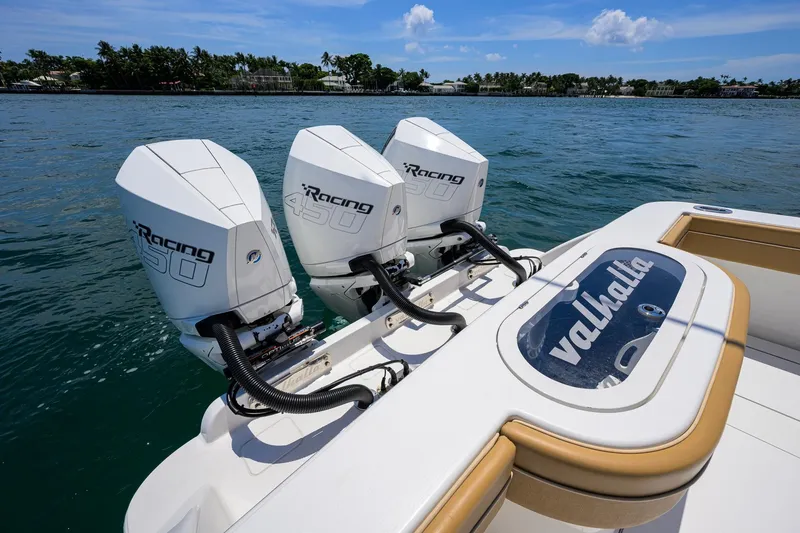Slide: The Image of 2023 Valhalla Boatworks V-37 with triple Racing 450 engines on water. - 55