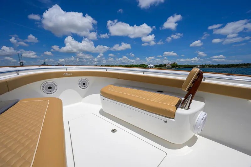 Slide: The Image of 2023 Valhalla Boatworks V-37 interior with tan seating under a bright blue sky. - 26