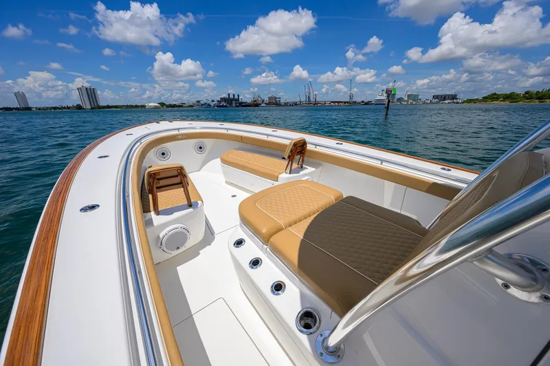 Slide: The Image of 2023 Valhalla Boatworks V-37 on water, featuring luxurious seating and sleek design. - 23