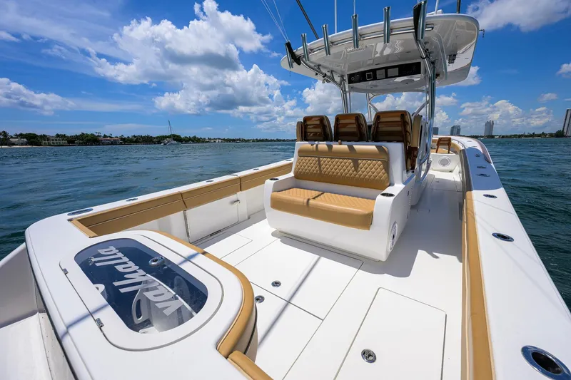 Slide: The Image of 2023 Valhalla Boatworks V-37 on water, featuring luxurious seating and sleek design. - 48