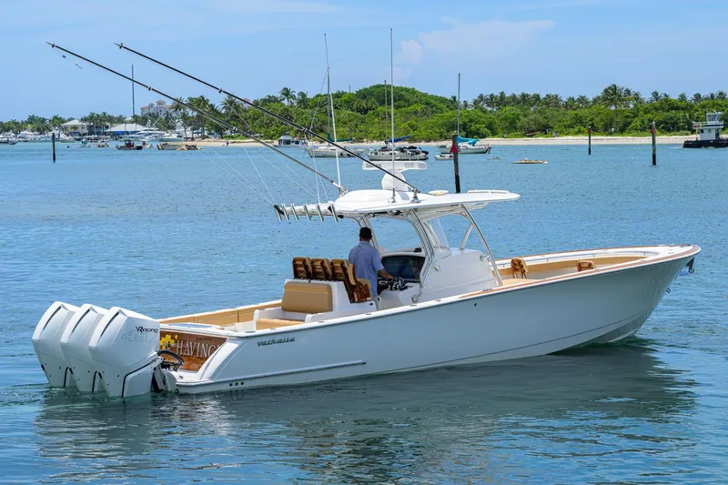Slide: The Image of 2023 Valhalla Boatworks V-37 cruising on a sunny day, equipped with triple outboard engines. - 10