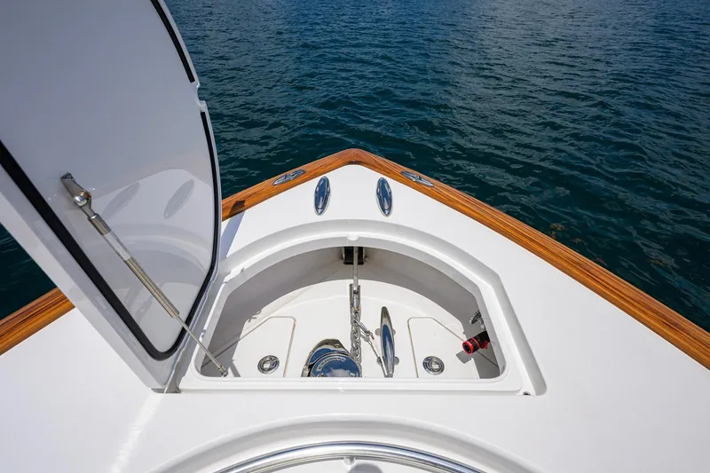 Slide: The Image of 2023 Valhalla Boatworks V-37 anchor compartment with open hatch, showcasing sleek design. - 28