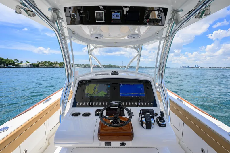 Slide: The Image of 2023 Valhalla Boatworks V-37 helm with advanced navigation system on open water. - 14
