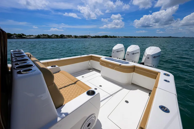 Slide: The Image of 2023 Valhalla Boatworks V-37 on water, featuring spacious deck and triple outboard engines. - 39
