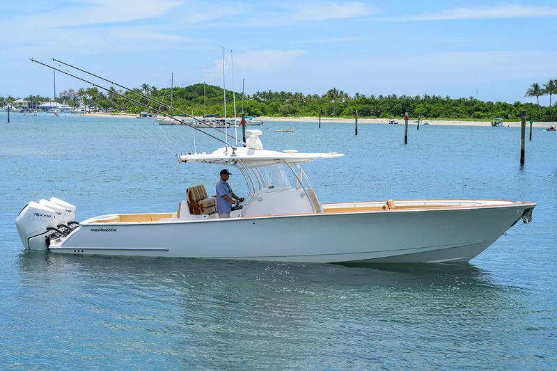 The Image of 2023 Valhalla Boatworks V-37 cruising on a sunny day, featuring twin outboard engines. - 0