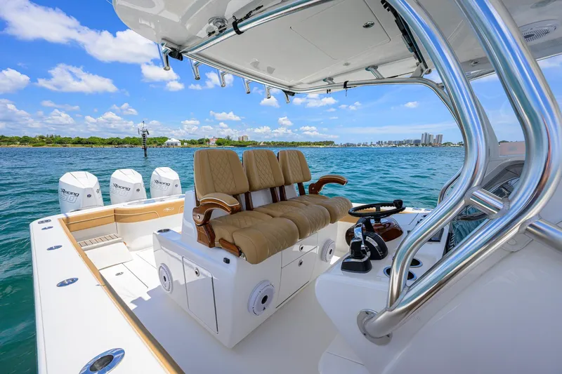 Slide: The Image of 2023 Valhalla Boatworks V-37 with luxurious seating and powerful engines on open water. - 18