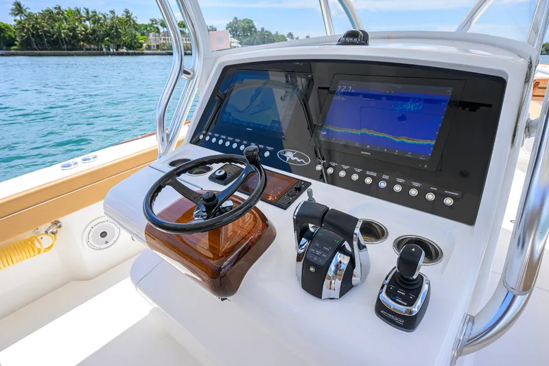 Slide: The Image of 2023 Valhalla Boatworks V-37 helm with advanced navigation displays and controls. - 15