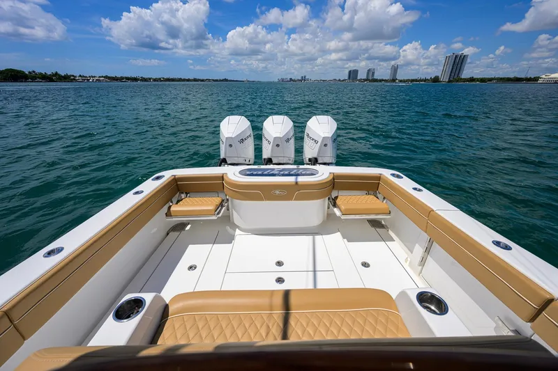 Slide: The Image of 2023 Valhalla Boatworks V-37 on open water, featuring triple outboard engines. - 38