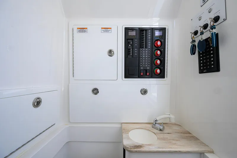 Slide: The Image of 2023 Valhalla Boatworks V-37 control panel and sink area, featuring modern design. - 59