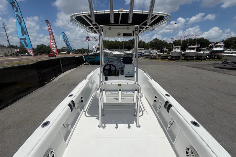 Slide: The Image of 2012 Glasstream 221 CC boat with center console, displayed outdoors under a blue sky. - 12
