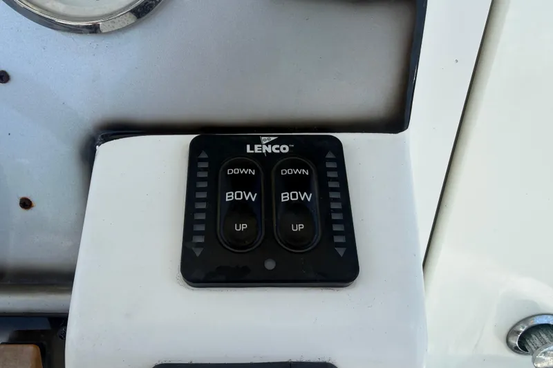 Slide: The Image of Lenco trim tab control on 2012 Glasstream 221 CC boat dashboard. - 20