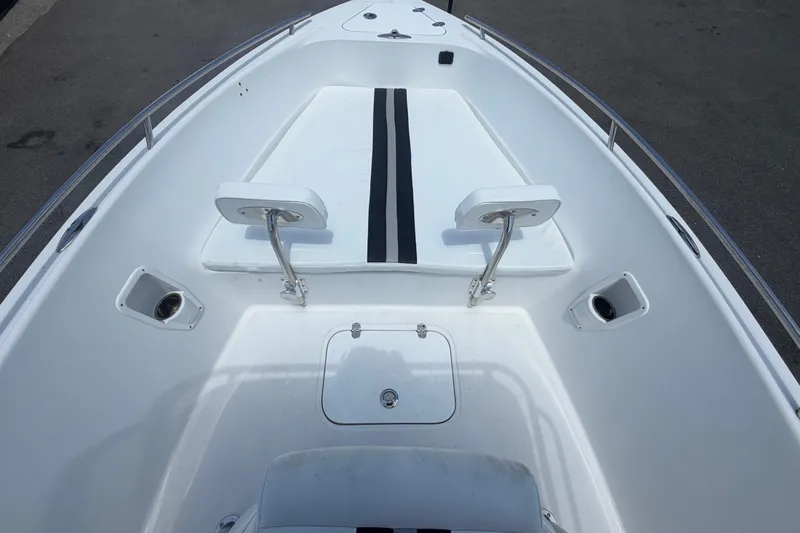 Slide: The Image of 2012 Glasstream 221 CC boat interior with seating and storage compartments. - 25