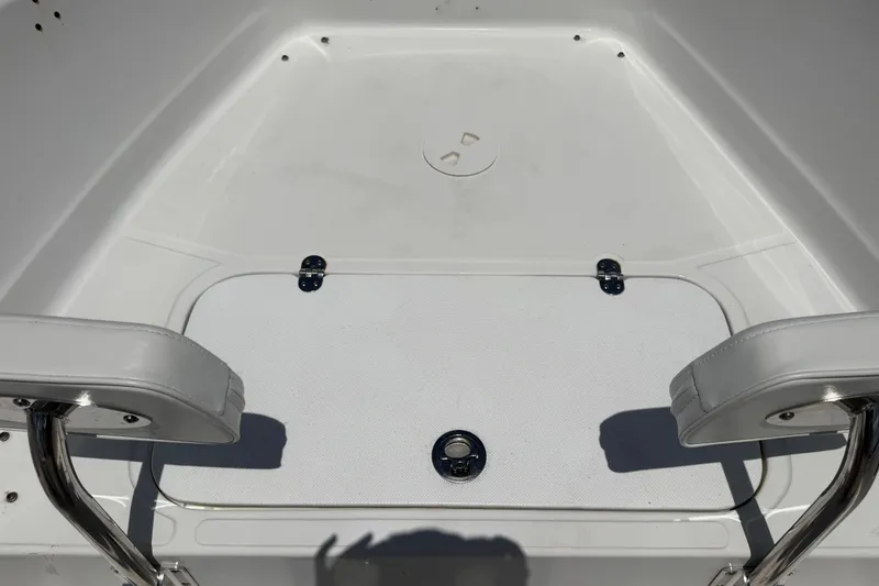 Slide: The Image of 2012 Glasstream 221 CC boat interior with white seating and storage compartment. - 29