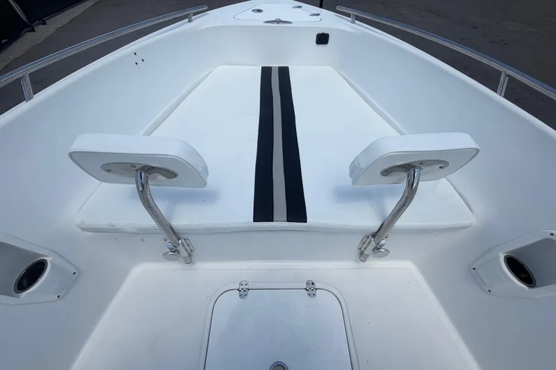 Slide: The Image of 2012 Glasstream 221 CC boat interior with white seating and stainless steel fixtures. - 31