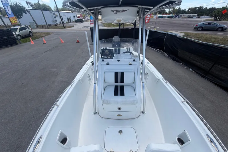 Slide: The Image of 2012 Glasstream 221 CC boat with T-top, parked on pavement near traffic cones. - 36