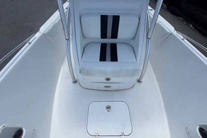 Slide: The Image of 2012 Glasstream 221 CC boat interior with white seating and storage compartment. - 37