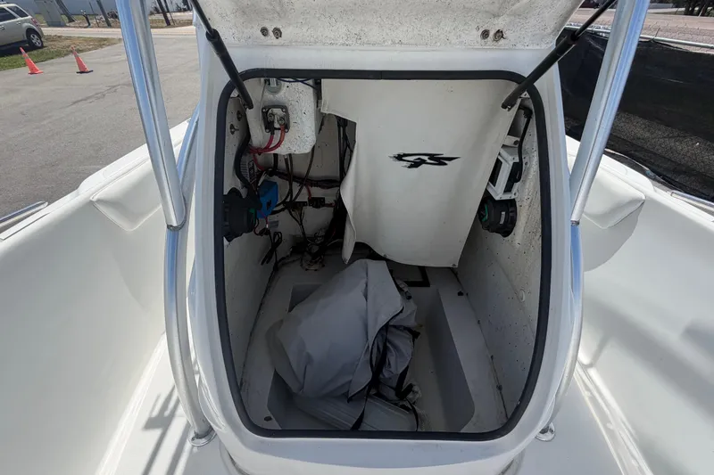 Slide: The Image of 2012 Glasstream 221 CC boat storage compartment with wiring and equipment. - 39