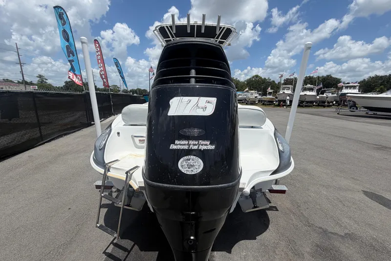 Slide: The Image of 2012 Glasstream 221 CC boat with 175 HP engine, displayed outdoors under a blue sky. - 4