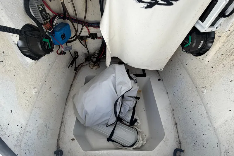 Slide: The Image of 2012 Glasstream 221 CC boat interior with wiring and storage compartment. - 40