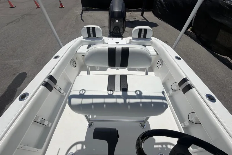 Slide: The Image of 2012 Glasstream 221 CC boat interior with white seating and black accents. - 43