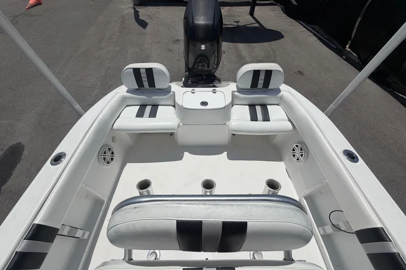 Slide: The Image of 2012 Glasstream 221 CC boat interior with seating and motor, viewed from above. - 45