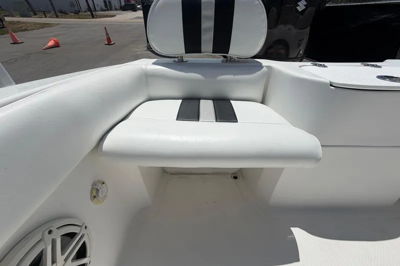 Slide: The Image of 2012 Glasstream 221 CC boat interior with white seating and speaker detail. - 48
