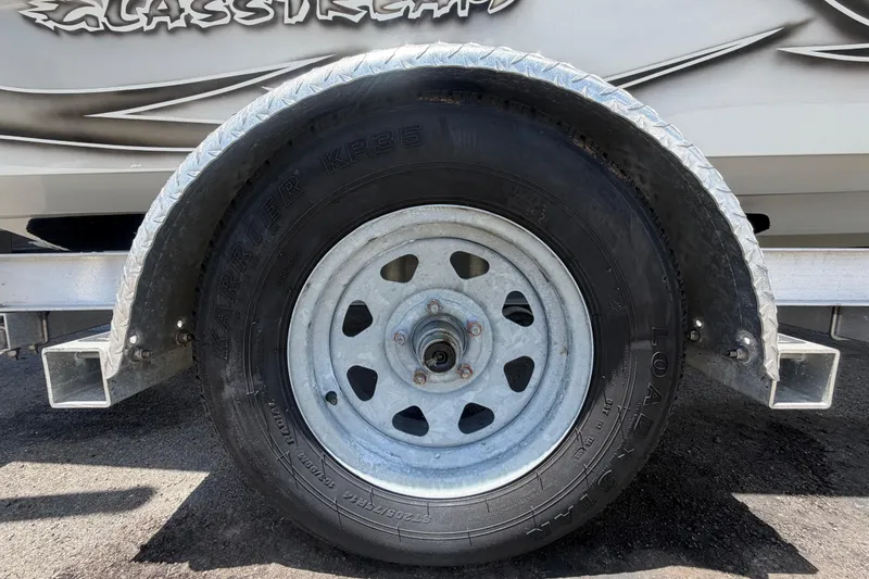 Slide: The Image of Trailer wheel of a 2012 Glasstream 221 CC boat, featuring Karrier KR35 tire. - 63