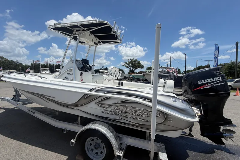 Slide: The Image of 2012 Glasstream 221 CC boat on trailer with Suzuki outboard motor, under clear blue sky. - 7