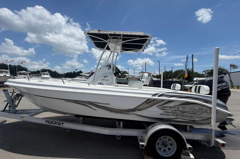 Slide: The Image of 2012 Glasstream 221 CC boat on trailer under clear blue sky. - 8