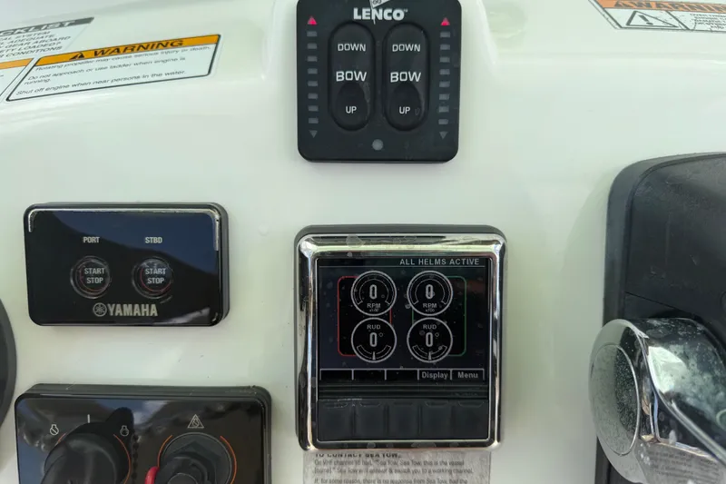 Slide: The Image of Control panel of a 2018 NauticStar 28 XS boat with Yamaha start/stop buttons. - 32