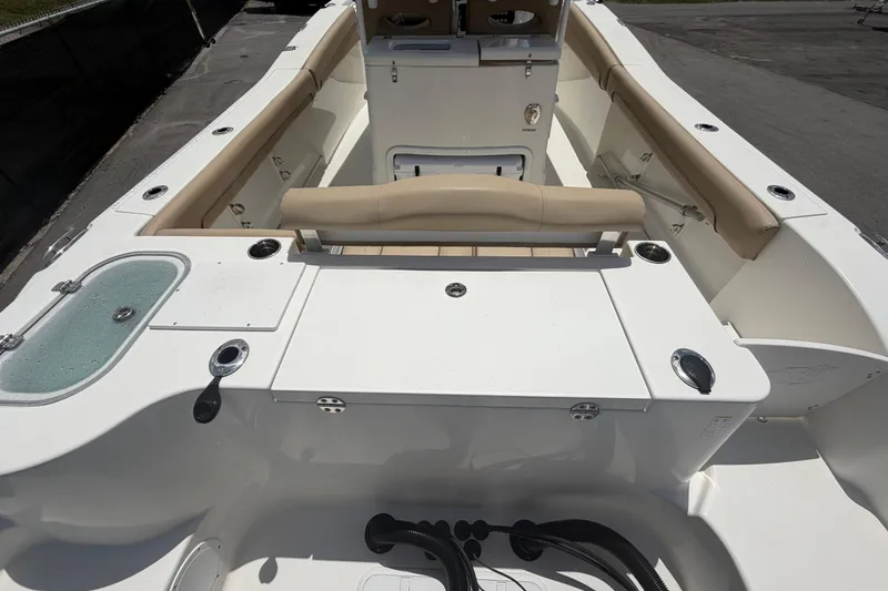 Slide: The Image of 2018 NauticStar 28 XS boat interior with seating and storage compartments. - 17