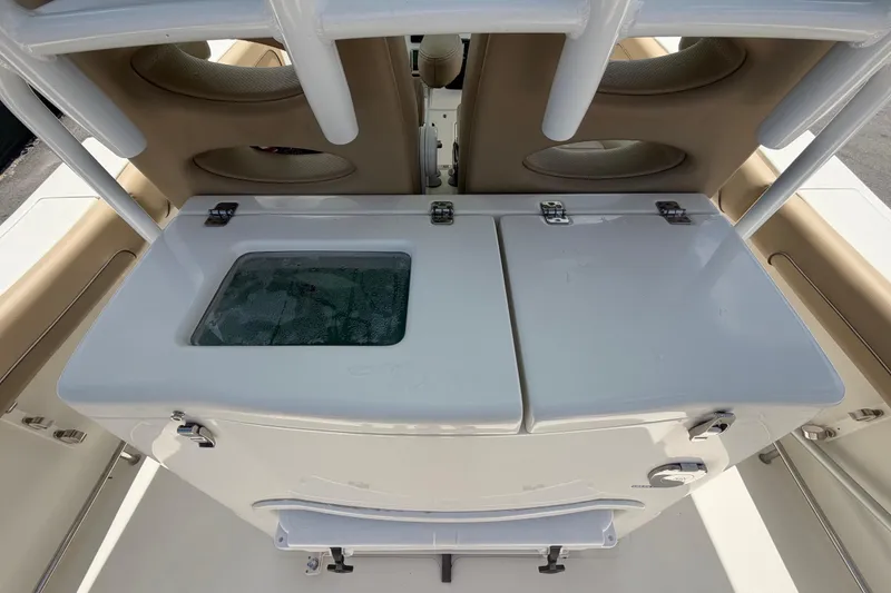 Slide: The Image of 2018 NauticStar 28 XS boat interior with livewell and storage compartments. - 20