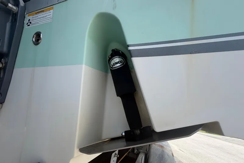 Slide: The Image of 2018 NauticStar 28 XS boat with Lenco trim tab detail. - 3