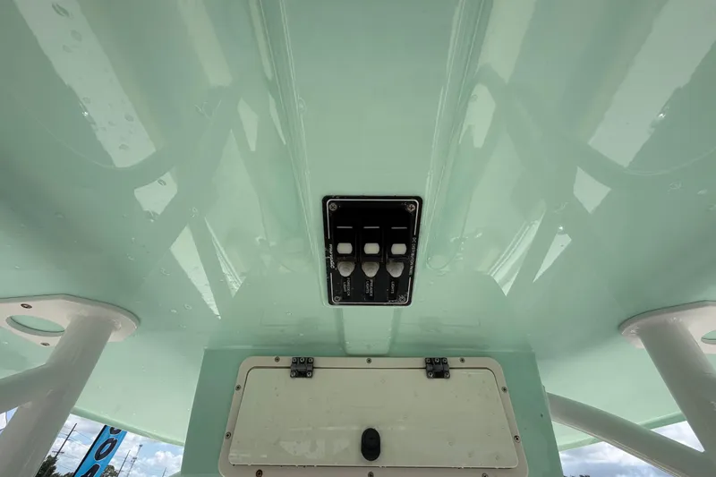 Slide: The Image of 2018 NauticStar 28 XS boat console with control panel and storage compartment. - 35