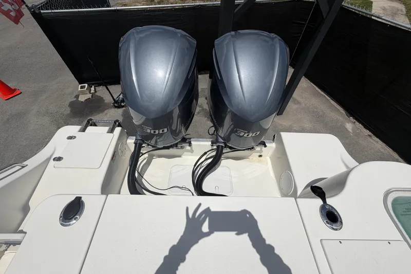 Slide: The Image of 2018 NauticStar 28 XS boat with dual Yamaha 300 engines, viewed from above. - 79