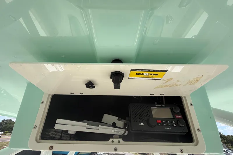 Slide: The Image of Storage compartment on 2018 NauticStar 28 XS boat with Simrad radio equipment. - 37