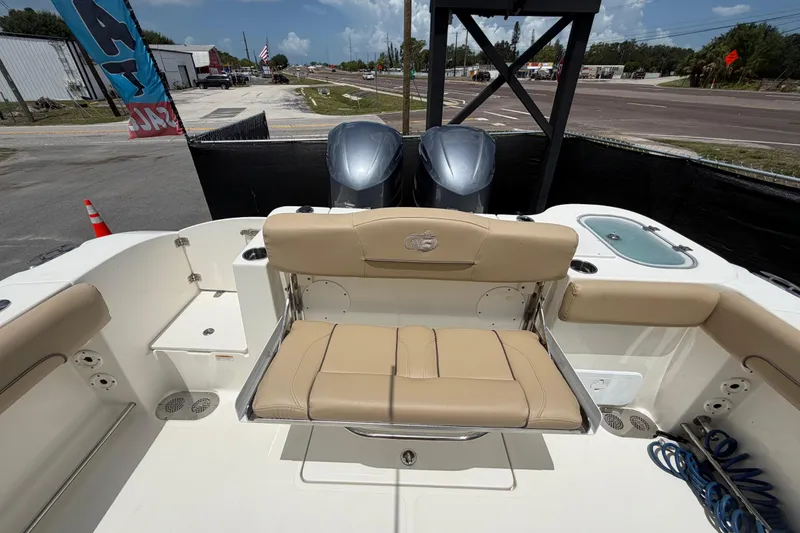 Slide: The Image of 2018 NauticStar 28 XS boat interior with seating and dual engines. - 68