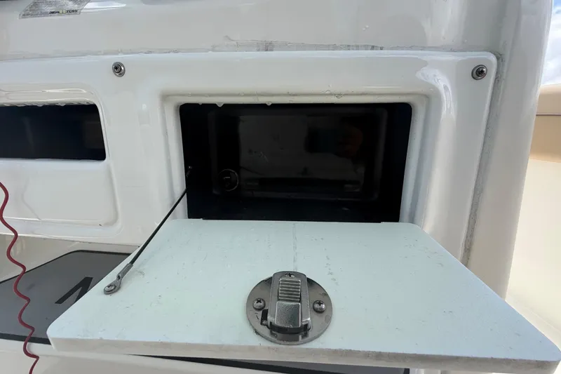 Slide: The Image of Open storage compartment on a 2018 NauticStar 28 XS boat. - 40