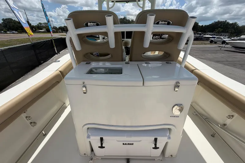 Slide: The Image of 2018 NauticStar 28 XS boat interior with seating and storage compartments. - 19