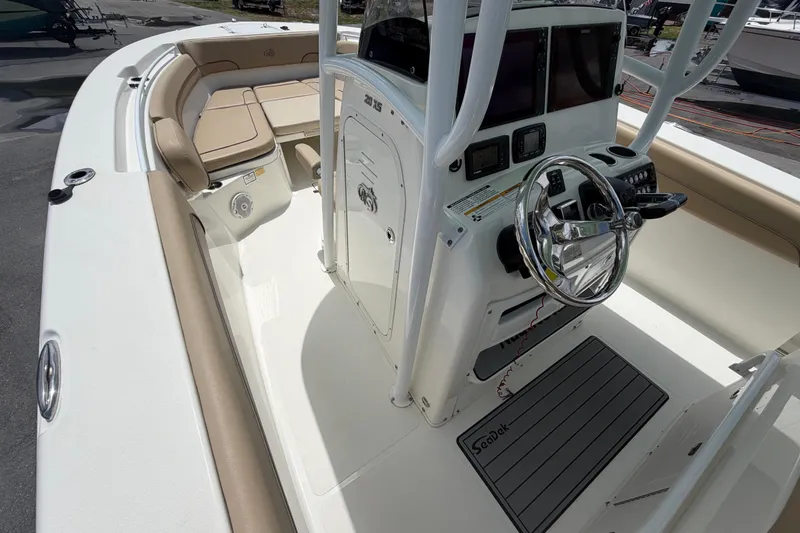 Slide: The Image of 2018 NauticStar 28 XS boat interior with steering console and seating area. - 41