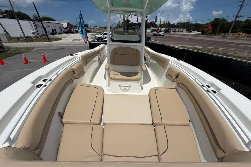 Slide: The Image of 2018 NauticStar 28 XS boat with spacious tan seating and sleek design. - 54