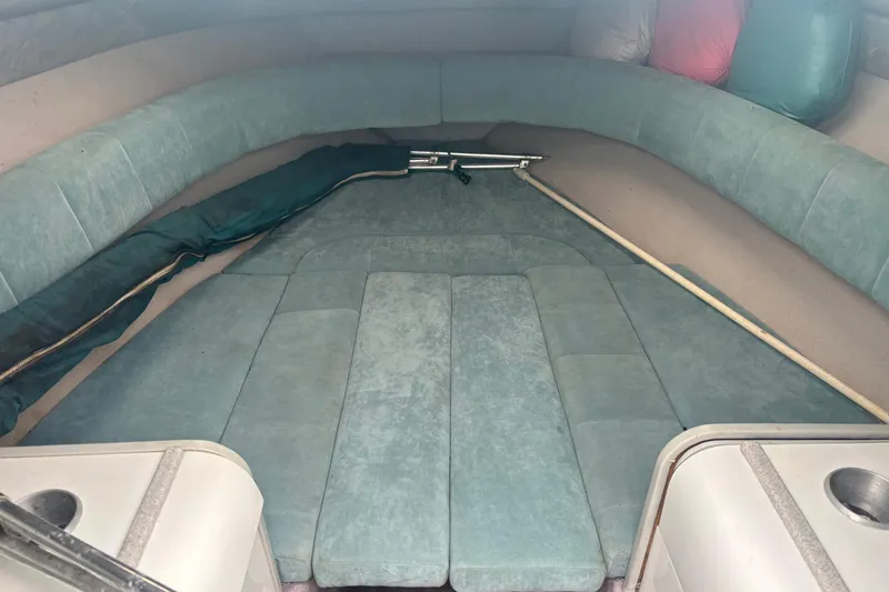 Slide: The Image of Interior cabin of a 1994 Formula 232 LS boat with teal upholstery. - 15