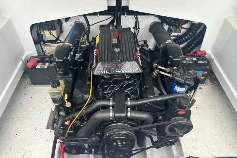 Slide: The Image of Engine compartment of a 1994 Formula 232 LS boat, featuring a 7.4L Bravo Three engine. - 17