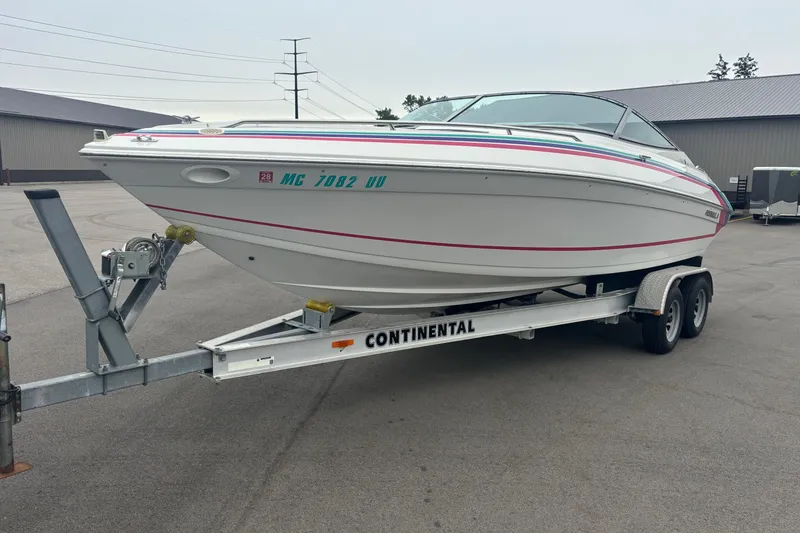 Slide: The Image of 1994 Formula 232 LS boat on Continental trailer in parking lot. - 2