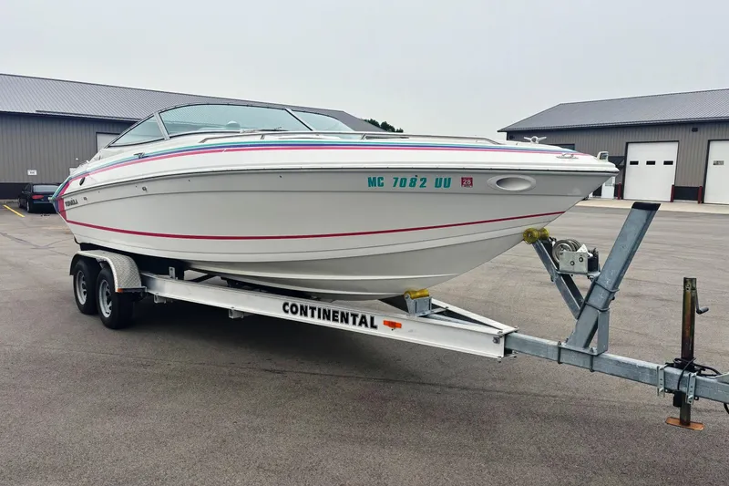 Slide: The Image of 1994 Formula 232 LS boat on Continental trailer in parking lot. - 3