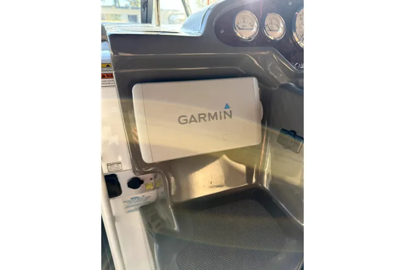 Slide: The Image of Garmin navigation system on 2011 Regal 2565 Express Cruiser dashboard. - 4